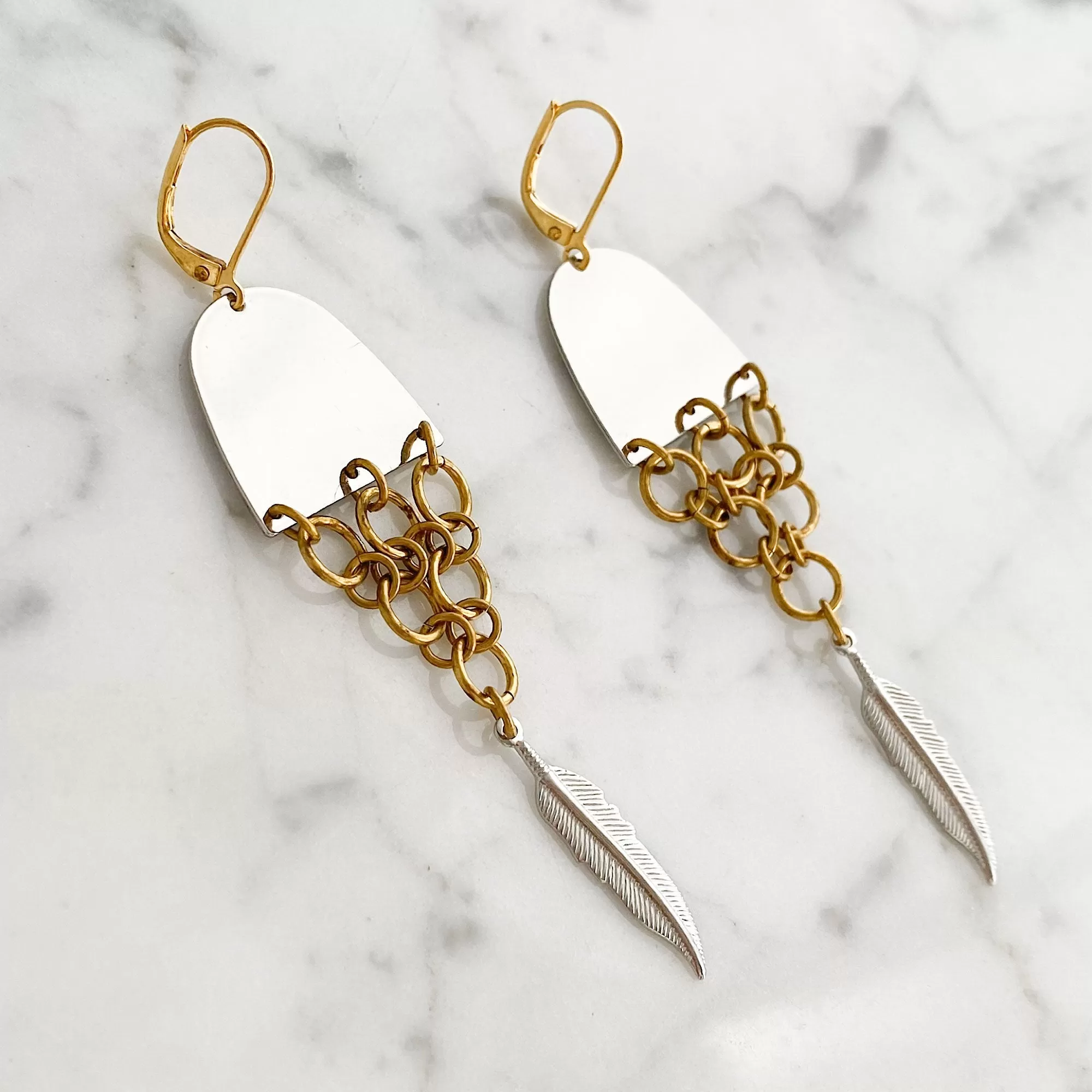 MONOHAN silver and brass fishtail earrings